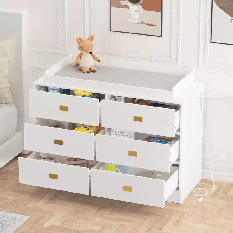 White six-drawer nursery dressing table/changing table - removable tabletop with changing mat, includes storage space for clothes and accessories.