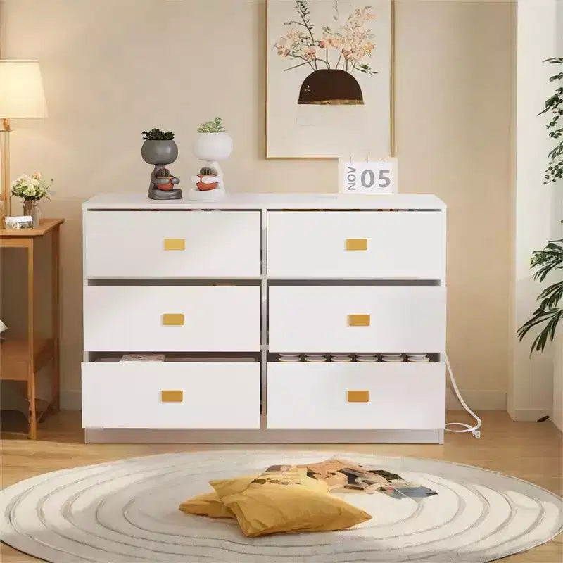 White six-drawer nursery dressing table/changing table - removable tabletop with changing mat, includes storage space for clothes and accessories.